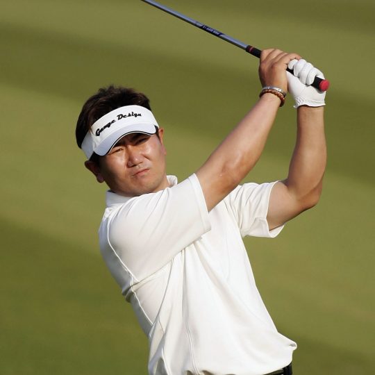HSBC Champions Final Round SHANGHAI, CHINA - NOVEMBER 12: Yong-Eun Yang of Korea plays his second shot on the par four 16th hole during the final round the HSBC Champions tournament at the Sheshan International Golf Club on November 12, 2006 in Shanghai, China. (Photo by Ross Kinnaird/Getty Images)